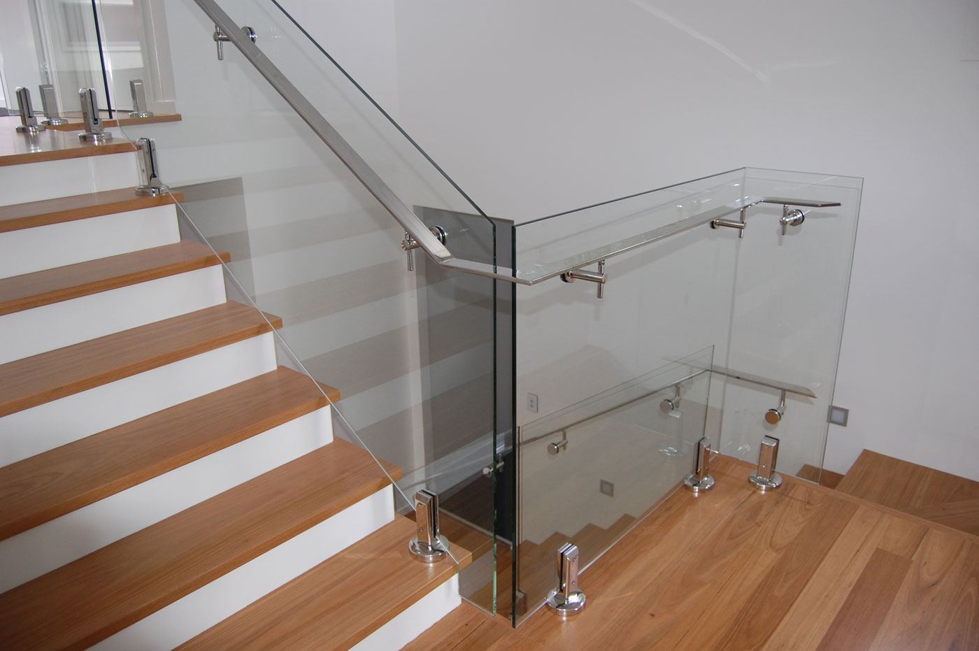 12mm Clear Toughened Glass - Flat Polished Edgework / Framless Internal Balustrades with Spigotts and Handrail - DnD Glass & Glazing