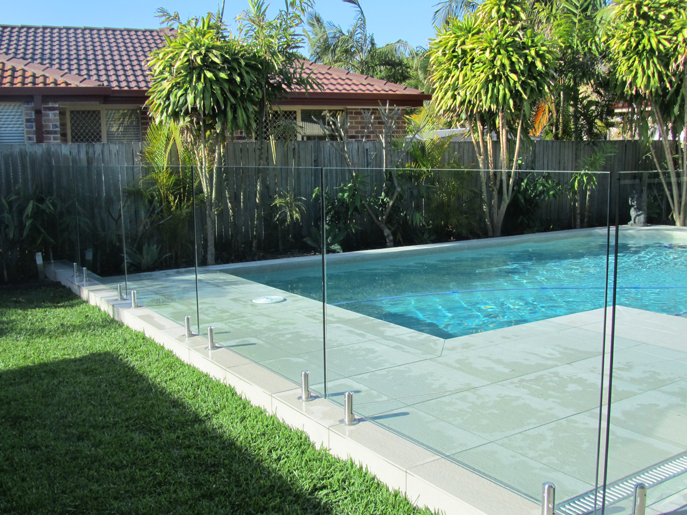 Frameless Pool Fencing - 12mm Clear Toughened Glass - Chrome Round Spigots - DnD Glass & Glazing - Tweed Heads South NSW