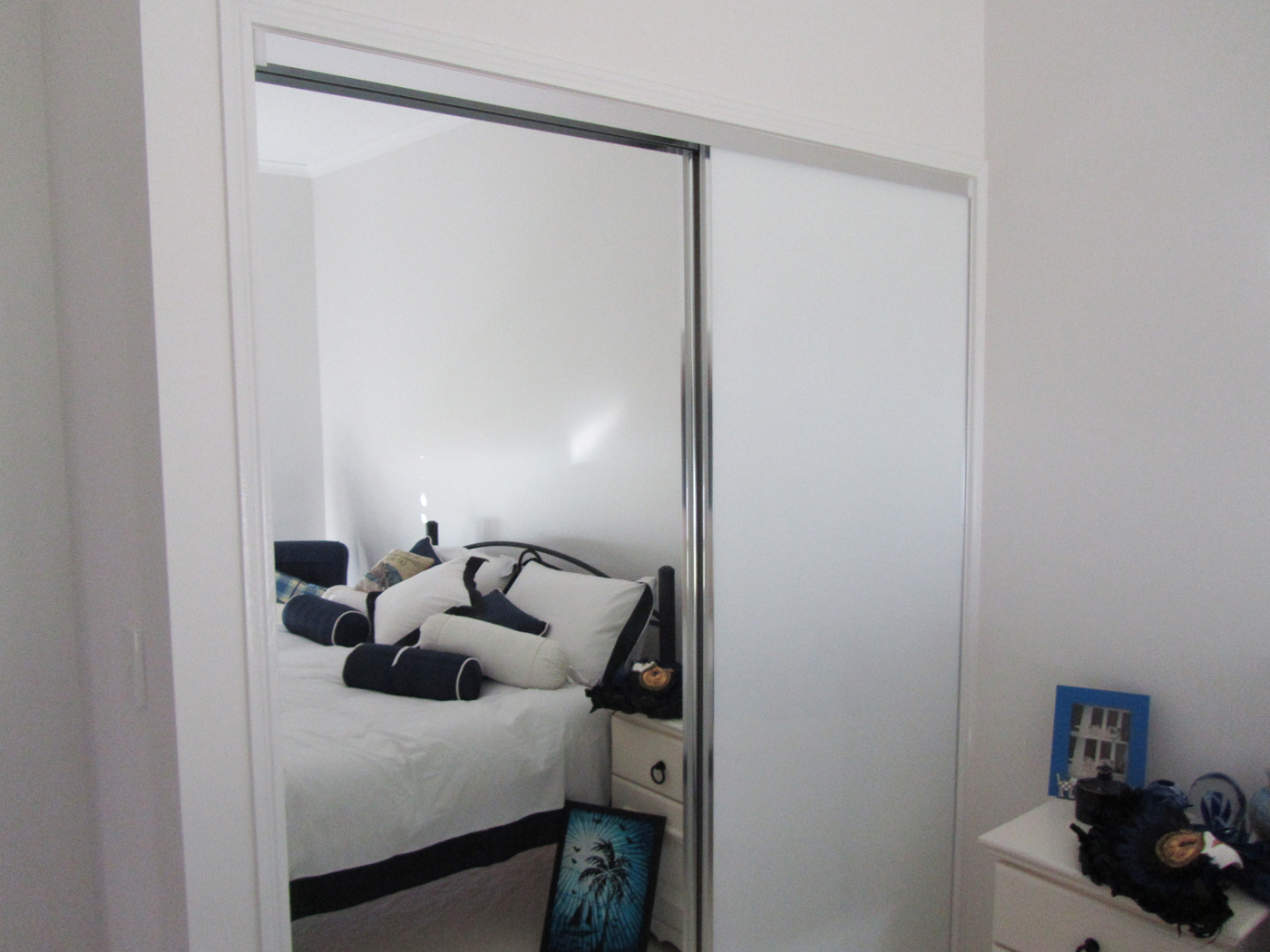 Frameless Wardrobe / chrome frame / 1 x Mirror door & 1 White Glass door - by DnD Glass & Glazing